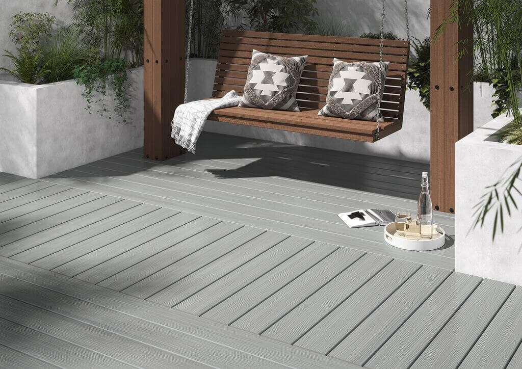 grey composite decking with a swing chair