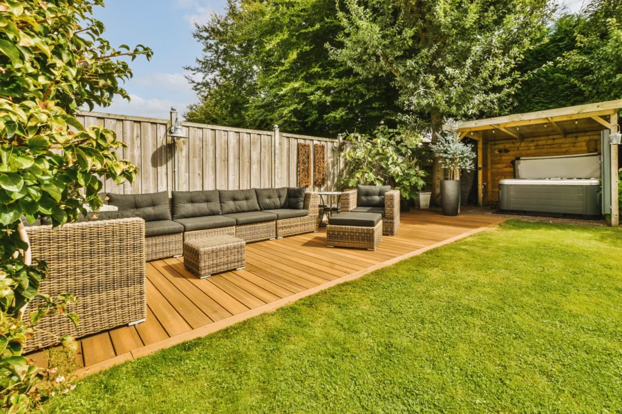 composite decking with patio furniture and hot tub