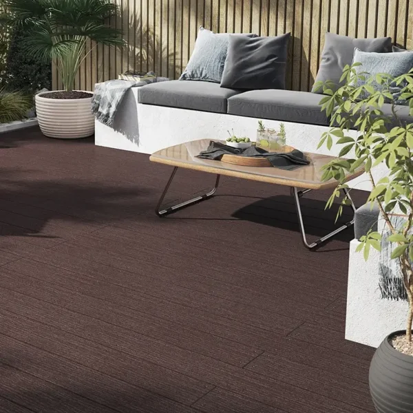 Brown Heritage composite decking in the sunlight, with garden furniture