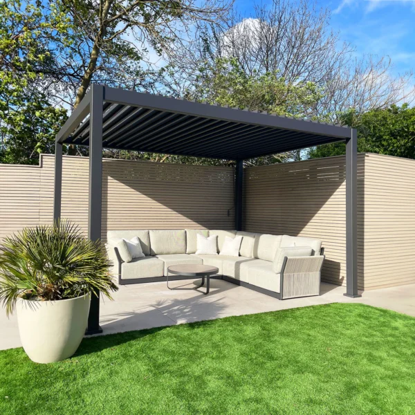 Grey Freestanding Aluminium Pergola above a large L-shaped sofa