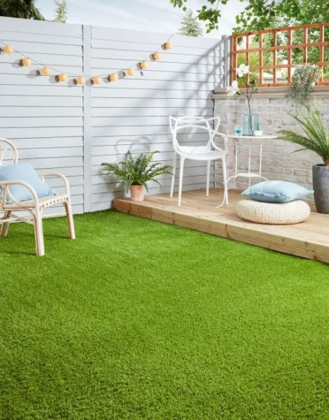 Outdoor patio. Complete with decking, artificial grass, and furnished with garden furniture.